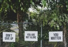 don't give up. You are not alone, you matter signage on metal fence